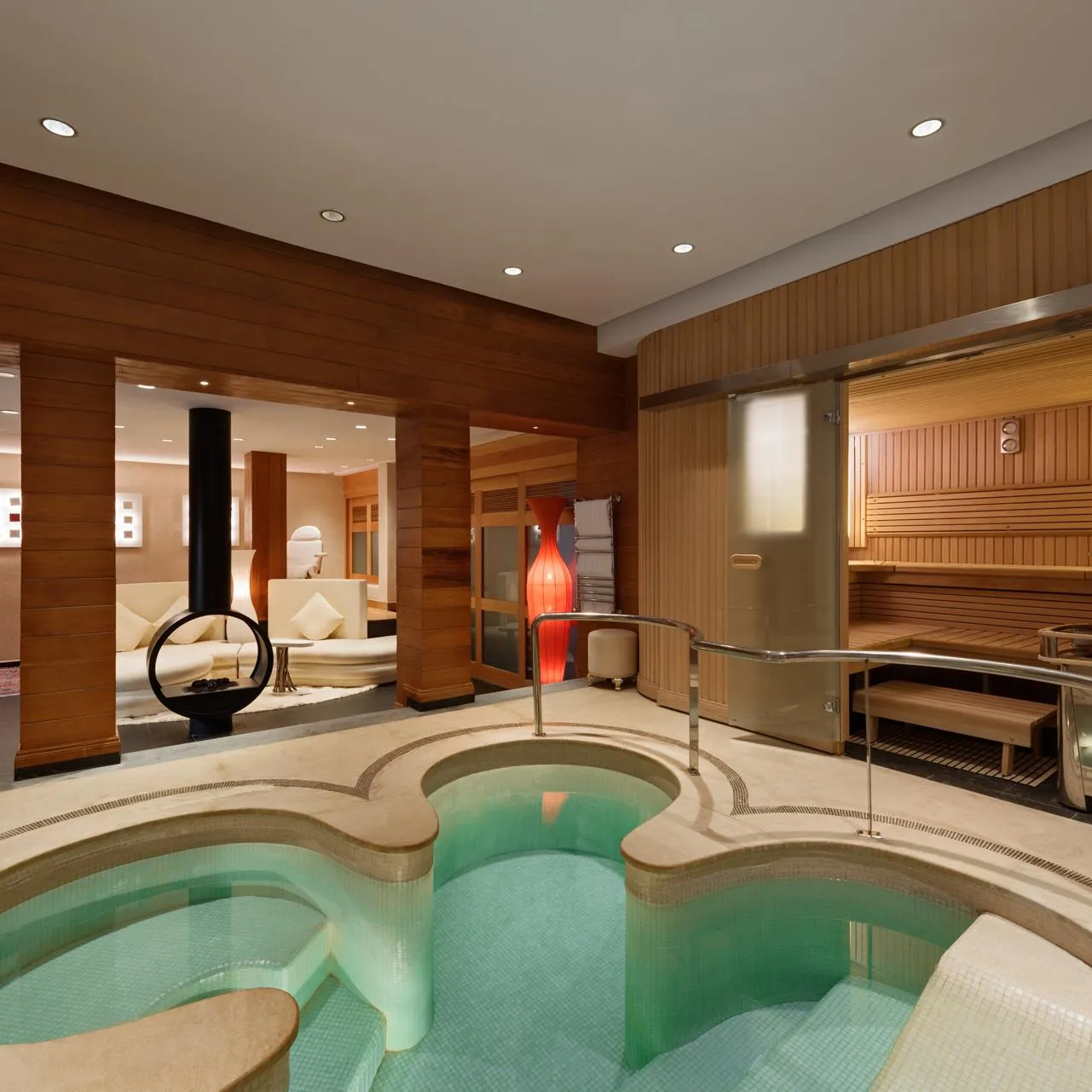 Spa room with hot water pool, sauna and wooden relaxation area