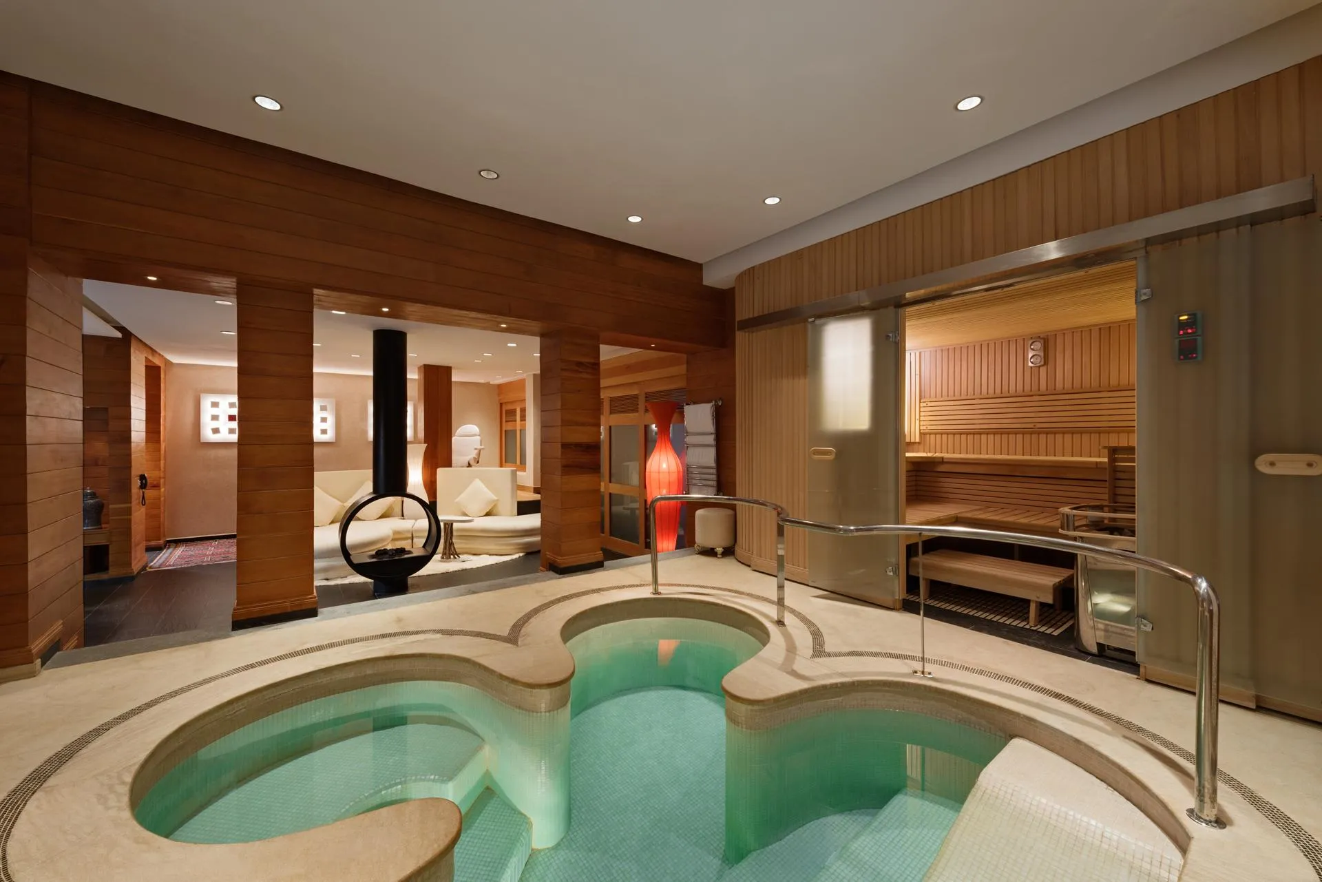 Spa room with hot water pool, sauna and wooden relaxation area